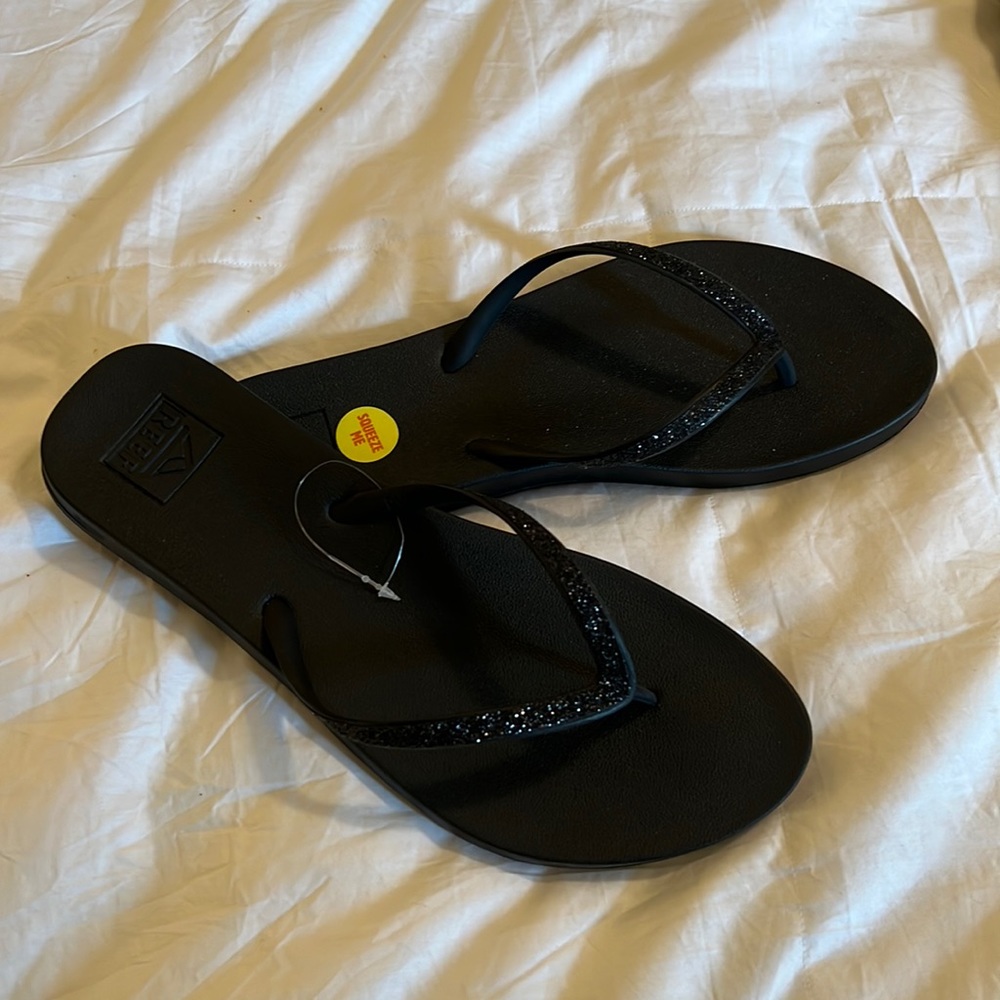 Never worn Reef flip flops